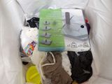 a bag full of clothes and a book on the bed