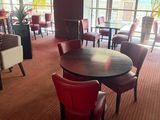 many chairs and tables in this restaurant with a large window