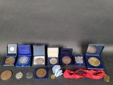 some of the medals and medals are on display on the table