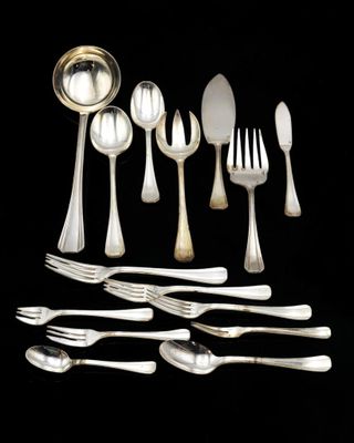 an assortment of silverware including spoons, forks and spoons