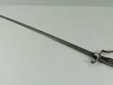 a sword that is on a table in a room