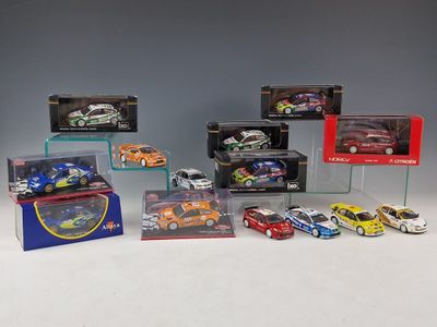 a group of toy cars are displayed in a display case