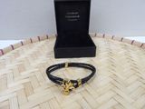 black leather bracelet with gold plated skull charm