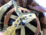 a close up of a helmet with a leather handle