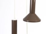 three lights hanging from the ceiling of a room