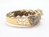 a gold ring with a heart shaped diamond on it