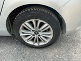 a close up of a car ' s tire on the road