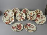 many plates and bowls that are sitting on a table