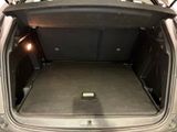 the back of a car with the trunk open and the seats down