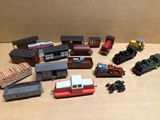 a lot of toy trains that are sitting on a table