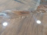 a close up of a piece of wood on a table