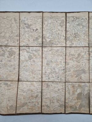 an old map of the world is laid out on a piece of paper