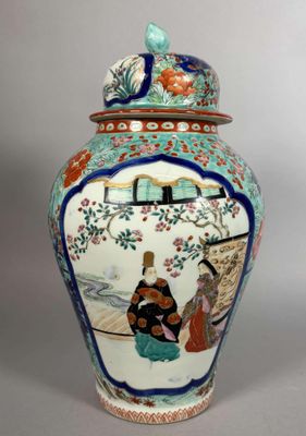 a vase with a lid that has a painting on it