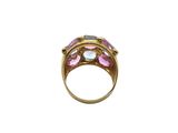 a close up of a gold ring with pink and white stones