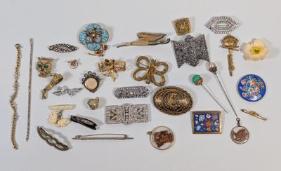 many different types of jewelry on a white surface