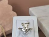 a white box with a silver ring inside of it