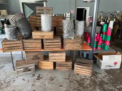 a pile of wooden crates and other items on the floor