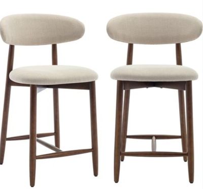 pair of mid century style bar stools with upholstered backrests
