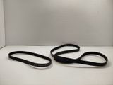 a pair of black belts sitting on top of a white table