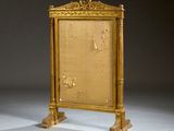 a gold frame with a clock on top of it