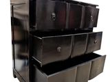 an image of a black chest of drawers on a white background