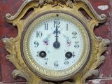 a clock that is on the side of a brick wall