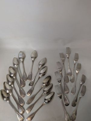 a lot of spoons and forks on the table