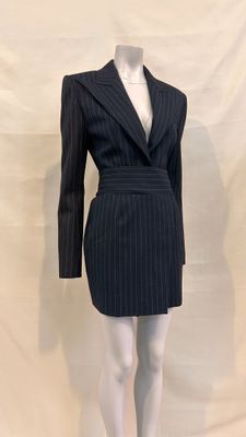 an image of a mannequin wearing a pinstripe suit
