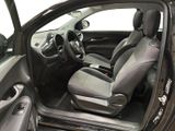 the interior of a car with the door open and the driver ' s seat up
