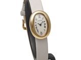 an image of a white and gold wrist watch with a black handle