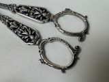 three spoons and a pair of scissors on a table