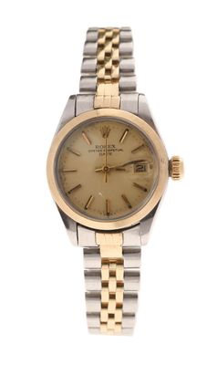 an image of a gold and silver wrist watch with roman numerals