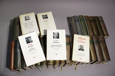 several books are stacked on top of each other on a table