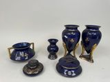a group of blue vases sitting on a table