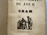 an old book with a picture of a man and a woman sitting on a couch