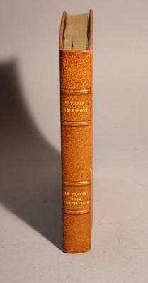 a brown book that is sitting on a table
