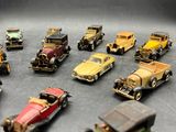 a lot of toy cars that are sitting on a table