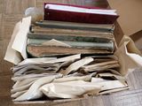 a box full of old books on the floor
