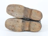 two pairs of shoes sitting on top of each other