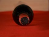a bottle of wine that is sitting on a table