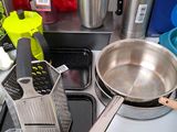 a counter top with a variety of kitchen items on it