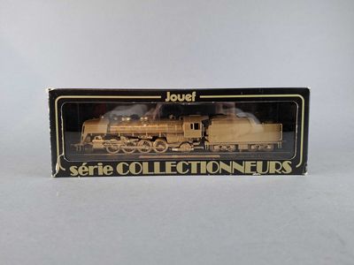 an image of a toy train set in a box on a white surface