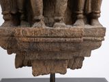 sculpture of a group of people on a pedestal with a white background