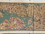 an old map of the world on display in a museum
