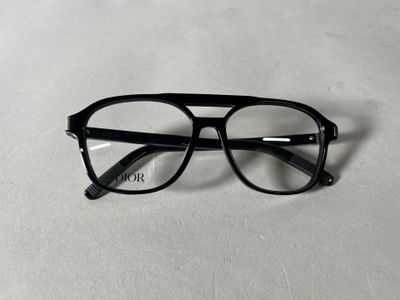 glasses on a table with a white surface and a white background