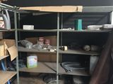 a room with shelves, shelves, and other items in it