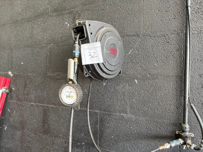 a fire hydrant that is attached to a wall