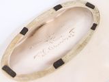 a close up of a white shoe with black trims
