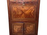 an image of a wooden cabinet with a marble top