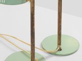 pair of green table lamps with brass bases and a glass shade
